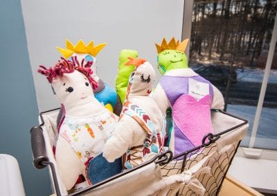 Handmade dolls at PUCK, United Counseling Services in Bennington Vermont. Photo description: Close up of hand made dolls in a basket.